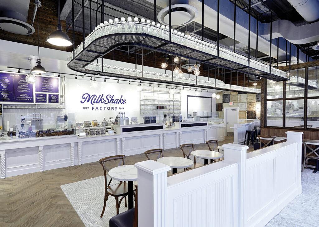 Interior of a MilkShake Factory store, featuring modern decor and a welcoming atmosphere for customers.