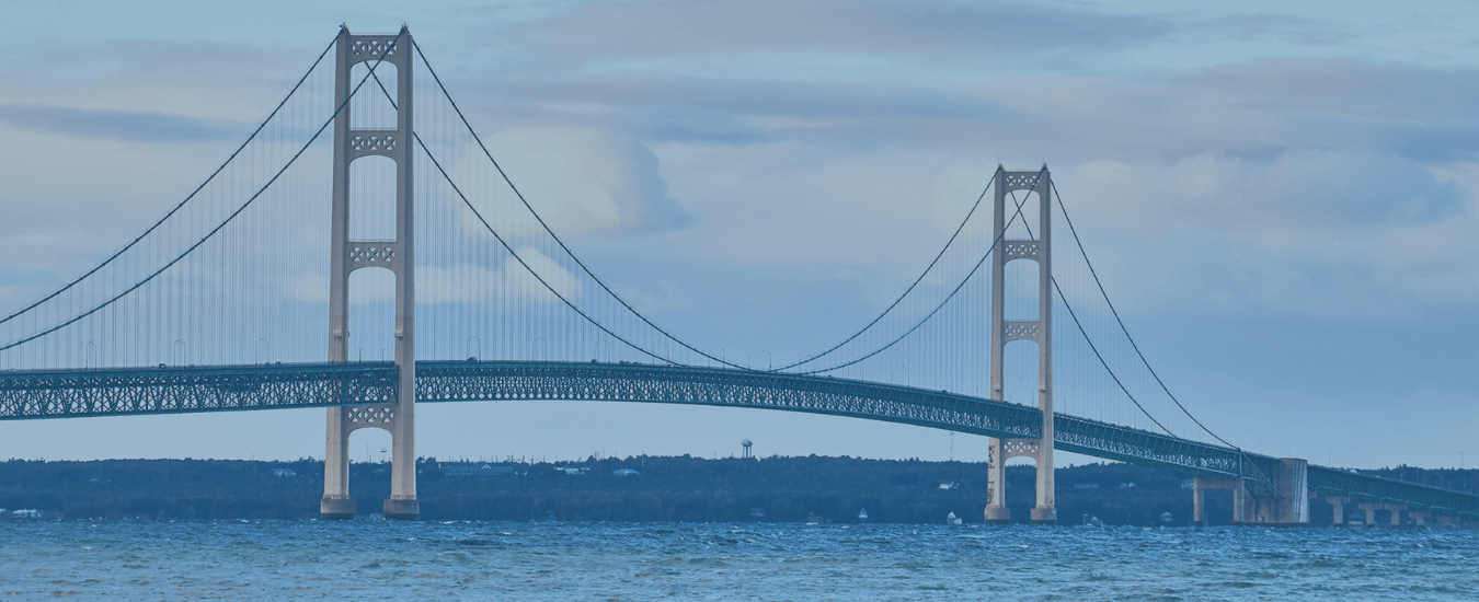 Mackinac Bridge with a clear sky, symbolizing franchise success and growth. 