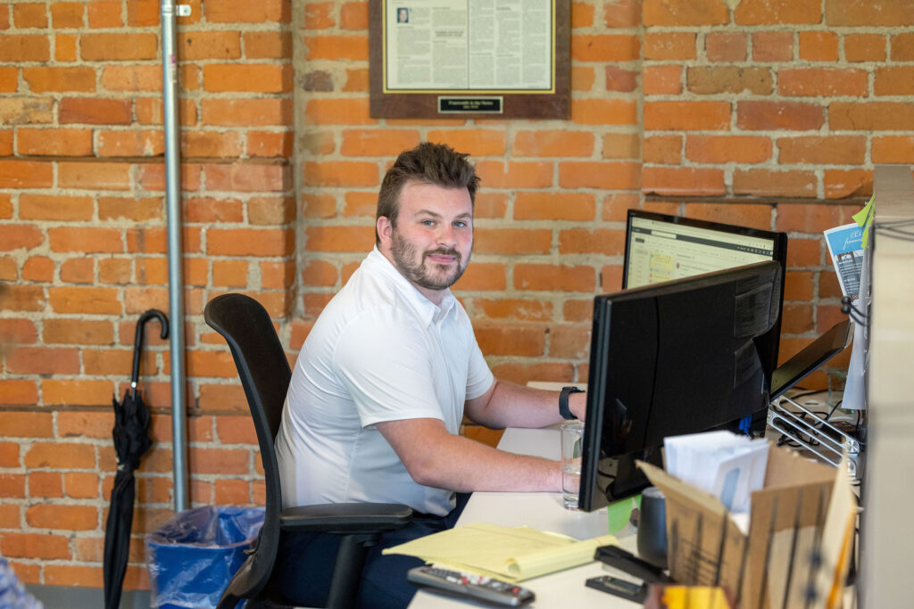 A man exploring how franchises work in an office setting.